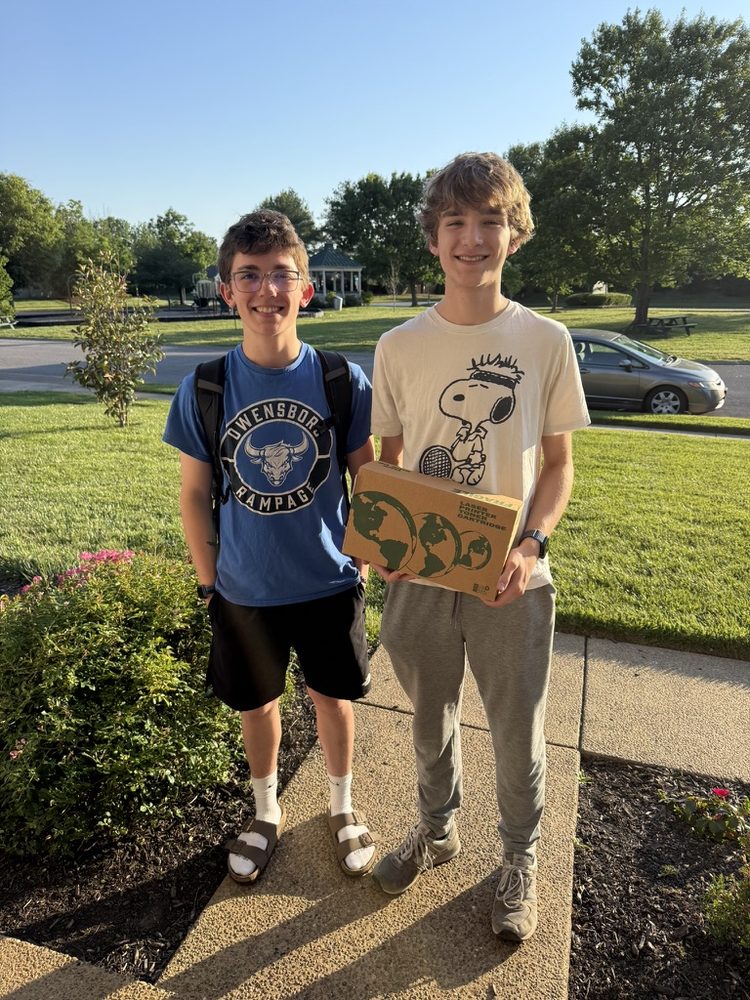 Collin Miller and Alexander Neel, founders of Owensboro On Demand, standing outside on a sunny day